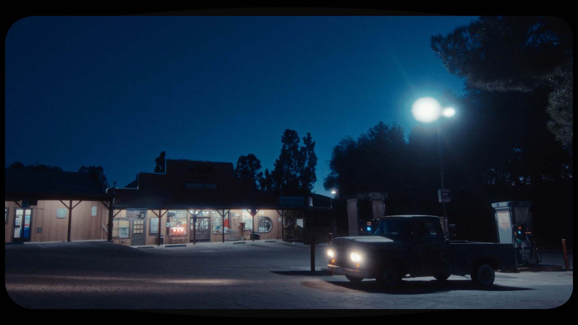 frames from music video, vintage look, added halation and vintage effects, gas station scene